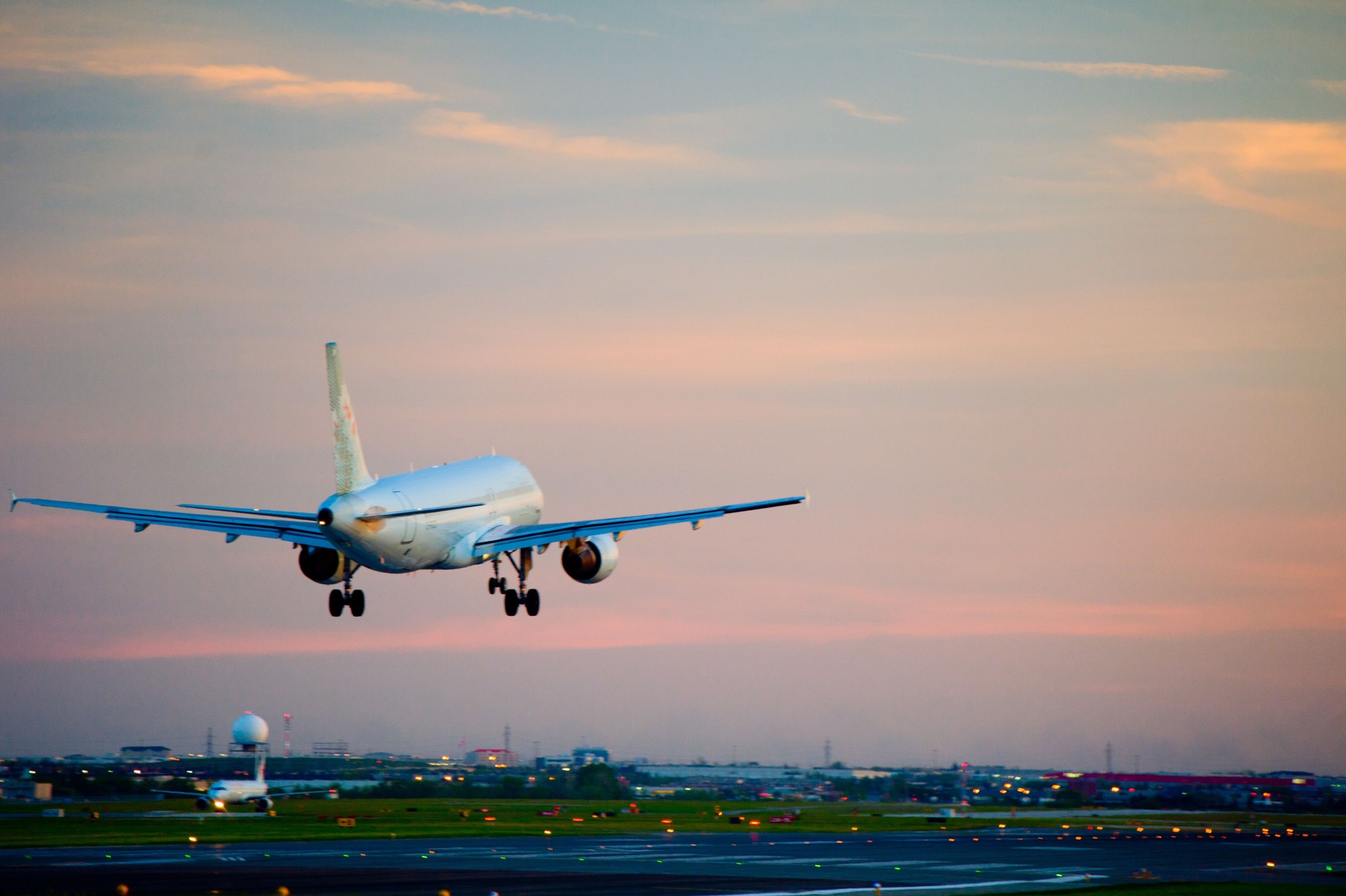 passenger plane fly up over take-off runway from airport